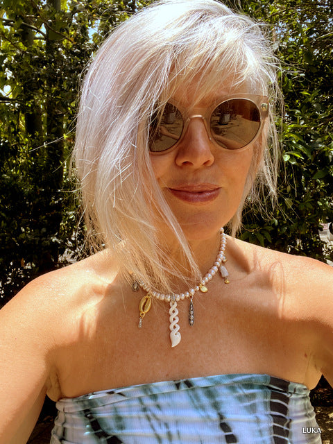 I am wearing the necklace in the shortest setting - it can be extended via the extender chain by 15-18cm