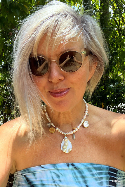 I am wearing the necklace in the shortest setting - it can be extended via the extender chain by 15-18cm